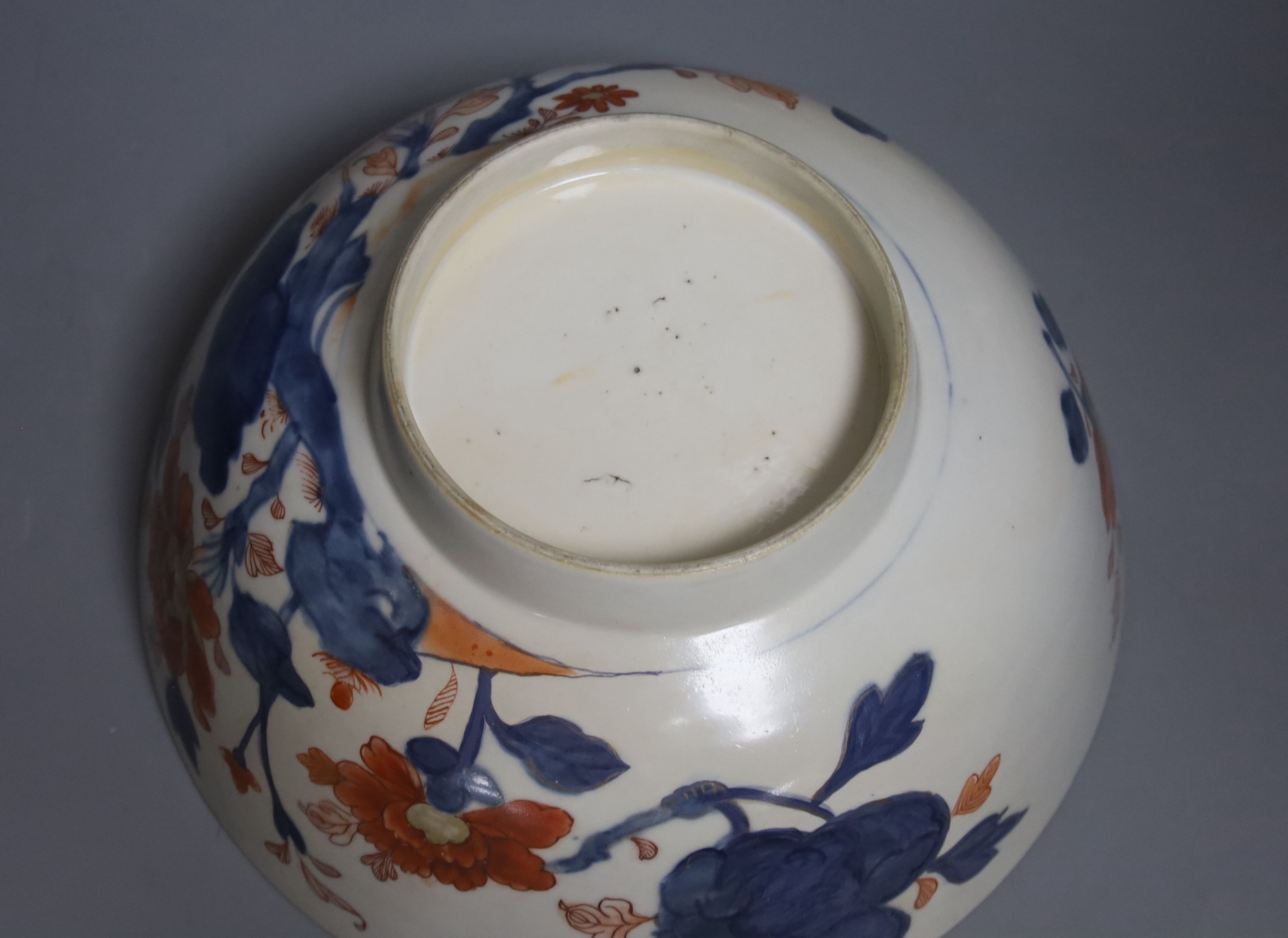 Three 18th century Chinese export porcelain bowls, largest 28 cm and two plates